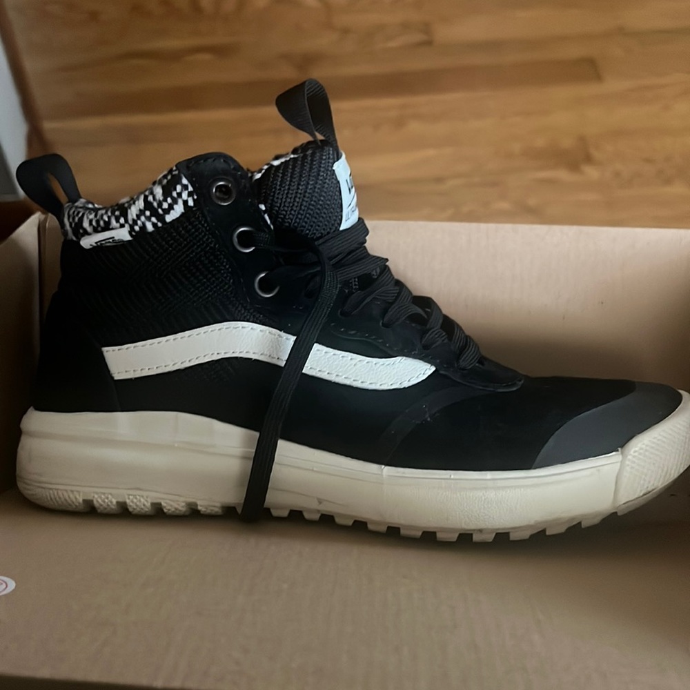 Women’s black suede and off white Vans